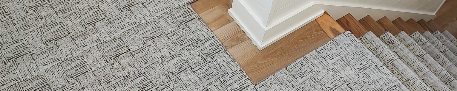 Grey chair on carpet - Kitty Hawk Carpets & Furniture in NC